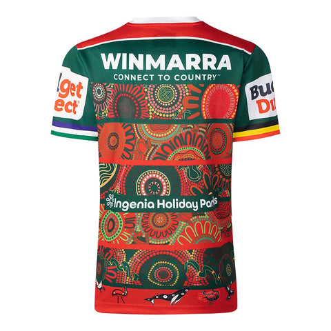 The back of a short-sleeve rugby league jersey featuring a green and red design with intricate Aboriginal-inspired circular dot art patterns. Visible text includes 'WINMARRA CONNECT TO COUNTRY' on the upper back, 'Ingenia Holiday Paris' across the center, and sponsor logos on the sleeves.